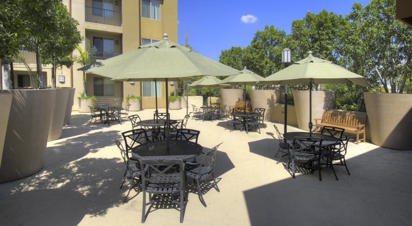 a group of tables and chairs outside