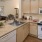 a kitchen with white cabinets