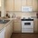 a kitchen with white cabinets