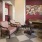 a room with a piano and chairs
